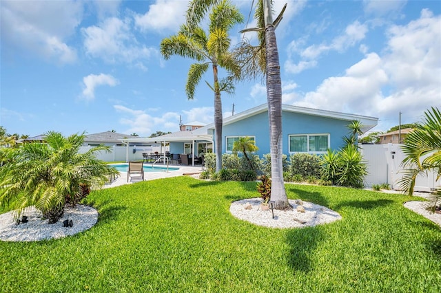 1769 Brookside Blvd, Largo, FL 33770 - rear view of house with stucco siding, a patio, and a gate