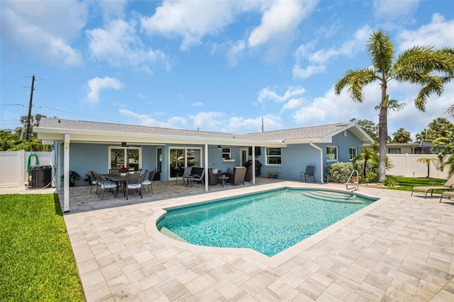 1769 Brookside Blvd, Largo, FL 33770 - view of swimming pool with fence, a patio area, a ceiling fan, and cooling unit