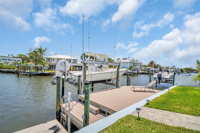 1769 Brookside Blvd, Largo, FL 33770 - dock area with boat lift, a water view, and a lawn