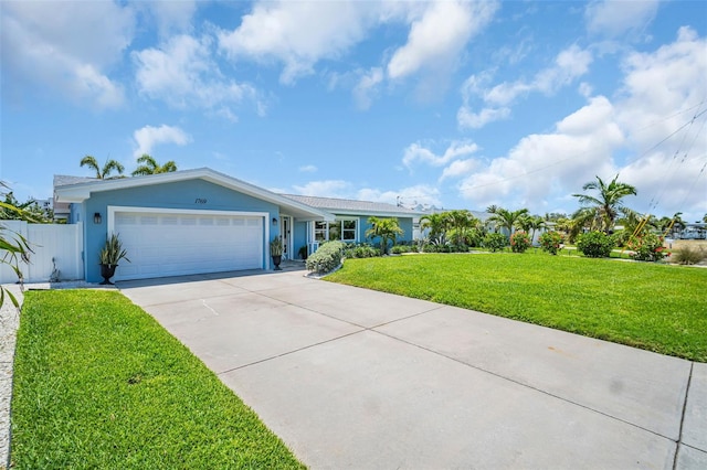 1769 Brookside Blvd, Largo, FL 33770 - ranch-style house featuring a garage, concrete driveway, and stucco siding