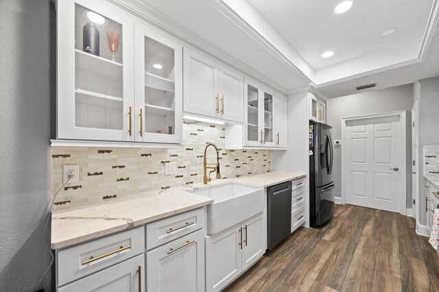 9722 Tiffany Oaks Ln, Tampa, FL 33612 - kitchen with stainless steel dishwasher, freestanding refrigerator, a sink, white cabinetry, and recessed lighting