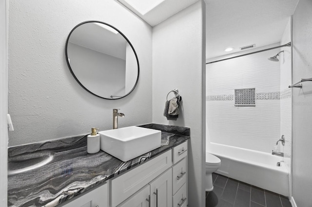 9722 Tiffany Oaks Ln, Tampa, FL 33612 - bathroom featuring toilet, vanity, and bathing tub / shower combination