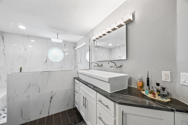 9722 Tiffany Oaks Ln, Tampa, FL 33612 - full bath with a marble finish shower, vanity, and a textured wall