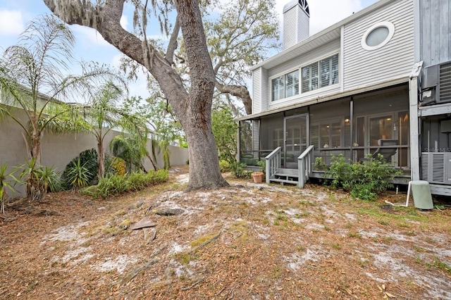 9722 Tiffany Oaks Ln, Tampa, FL 33612 - view of yard with a sunroom