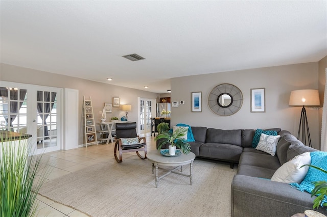 2012 Scotland Dr, Clearwater, FL 33763 - living room featuring light tile patterned floors and french doors