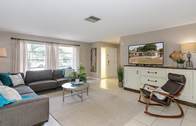2012 Scotland Dr, Clearwater, FL 33763 - living room with light tile patterned floors and baseboards