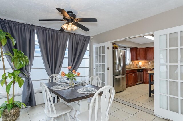 2012 Scotland Dr, Clearwater, FL 33763 - dining space with light tile patterned floors and ceiling fan