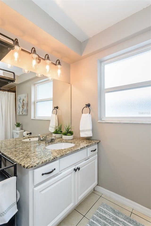 2012 Scotland Dr, Clearwater, FL 33763 - full bathroom featuring tile patterned flooring, vanity, and baseboards