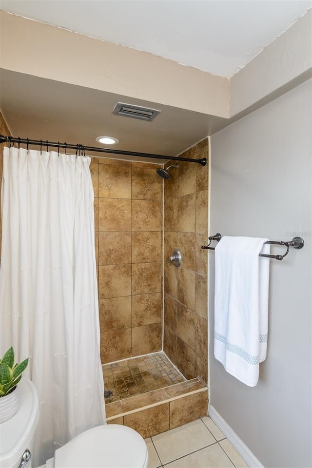 2012 Scotland Dr, Clearwater, FL 33763 - full bath with toilet, a tile shower, tile patterned flooring, and recessed lighting