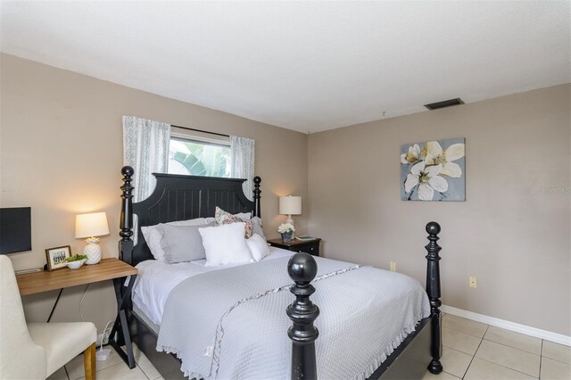 2012 Scotland Dr, Clearwater, FL 33763 - bedroom with light tile patterned floors and baseboards