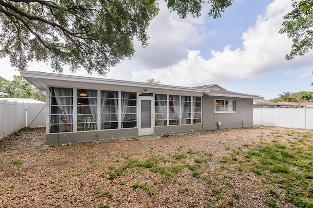 2012 Scotland Dr, Clearwater, FL 33763 - back of property featuring a sunroom and a fenced backyard
