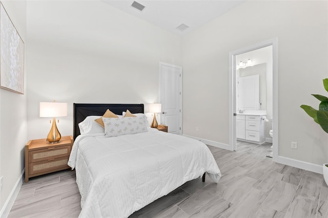 3888 Santa Caterina Blvd, Bradenton, FL 34211 - bedroom featuring light wood-style flooring and ensuite bathroom
