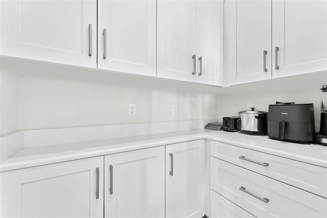 3888 Santa Caterina Blvd, Bradenton, FL 34211 - kitchen featuring white cabinetry and light countertops