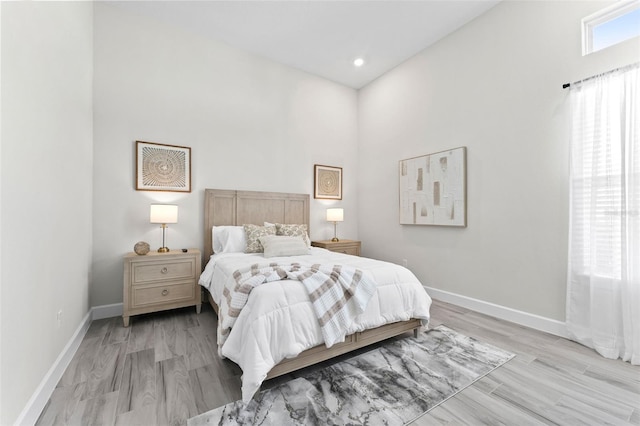 3888 Santa Caterina Blvd, Bradenton, FL 34211 - bedroom featuring light wood finished floors, recessed lighting, and a high ceiling