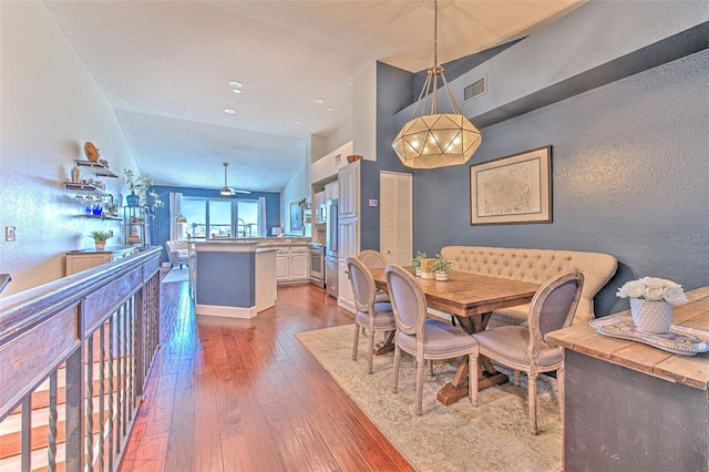 1111 Normandy Trace Rd Unit 1111, Tampa, FL 33602 - dining room with hardwood / wood-style floors and a textured wall