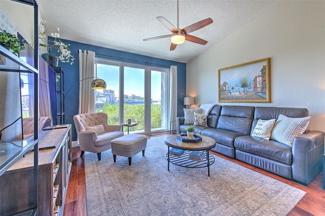 1111 Normandy Trace Rd Unit 1111, Tampa, FL 33602 - living room with ceiling fan, a textured ceiling, wood finished floors, and vaulted ceiling
