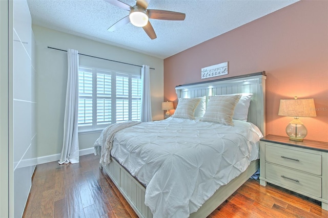 1111 Normandy Trace Rd Unit 1111, Tampa, FL 33602 - bedroom featuring a textured ceiling, hardwood / wood-style flooring, and a ceiling fan