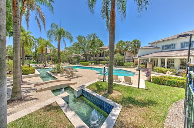 1111 Normandy Trace Rd Unit 1111, Tampa, FL 33602 - community pool featuring an area to practice putting, a patio, and a lawn