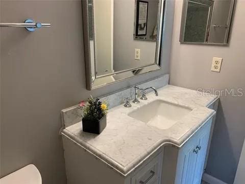 2720 Sand Hollow Ct Unit 156A, Clearwater, FL 33761 - half bathroom with vanity and toilet