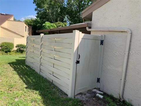 2720 Sand Hollow Ct Unit 156A, Clearwater, FL 33761 - gate featuring a lawn