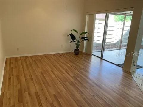 2720 Sand Hollow Ct Unit 156A, Clearwater, FL 33761 - unfurnished room with wood finished floors and baseboards