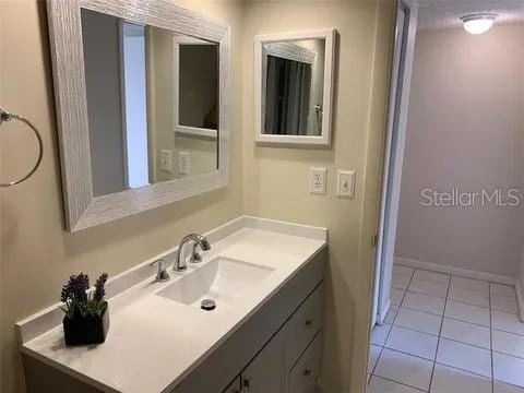 2720 Sand Hollow Ct Unit 156A, Clearwater, FL 33761 - bathroom featuring vanity, tile patterned floors, and baseboards