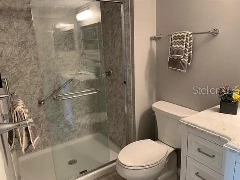2720 Sand Hollow Ct Unit 156A, Clearwater, FL 33761 - full bath featuring vanity, toilet, and a shower stall