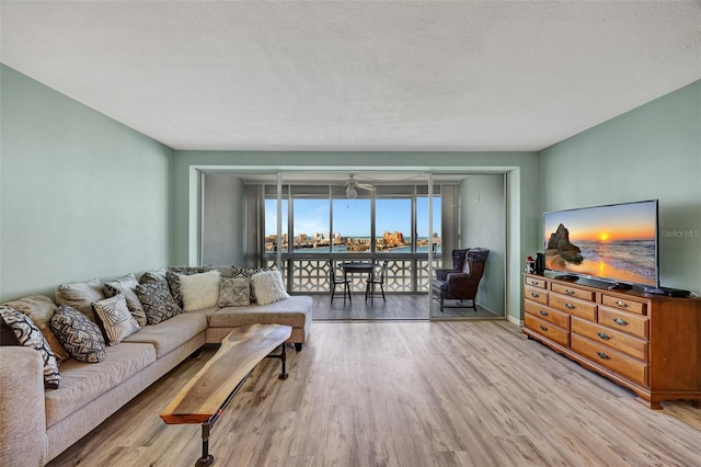 31 Island Way Unit 1403, Clearwater Beach, FL 33767 - living area featuring wood finished floors and ceiling fan
