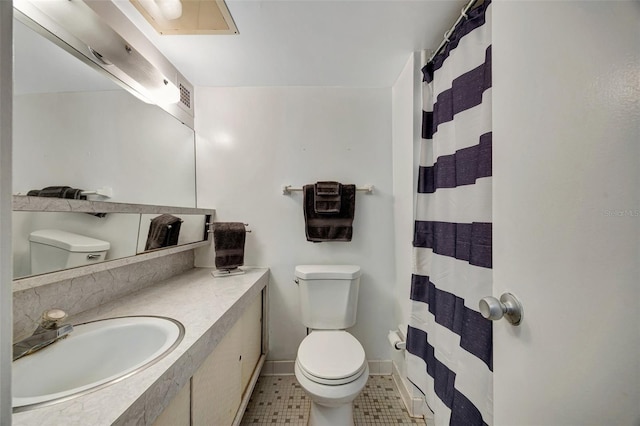 31 Island Way Unit 1403, Clearwater Beach, FL 33767 - full bathroom with toilet, curtained shower, vanity, and tile patterned floors