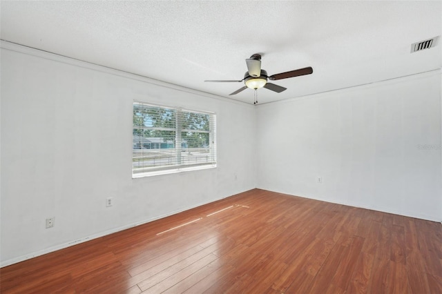 503 Holt Cir, Winter Haven, FL 33880 - unfurnished room featuring ceiling fan and wood finished floors