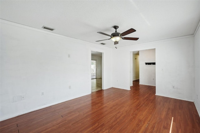 503 Holt Cir, Winter Haven, FL 33880 - empty room featuring a ceiling fan, wood finished floors, and ornamental molding