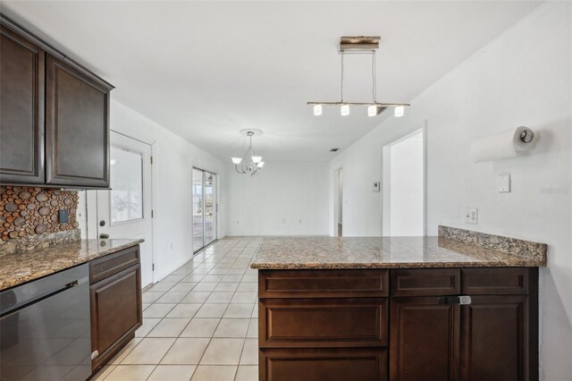 503 Holt Cir, Winter Haven, FL 33880 - kitchen featuring dishwasher, dark brown cabinetry, a chandelier, light tile patterned floors, and decorative backsplash