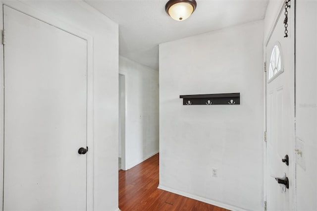 503 Holt Cir, Winter Haven, FL 33880 - foyer entrance featuring wood finished floors and baseboards