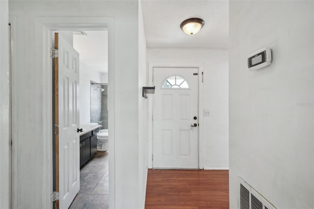 503 Holt Cir, Winter Haven, FL 33880 - foyer entrance featuring wood finished floors