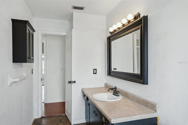 503 Holt Cir, Winter Haven, FL 33880 - bathroom featuring vanity and baseboards
