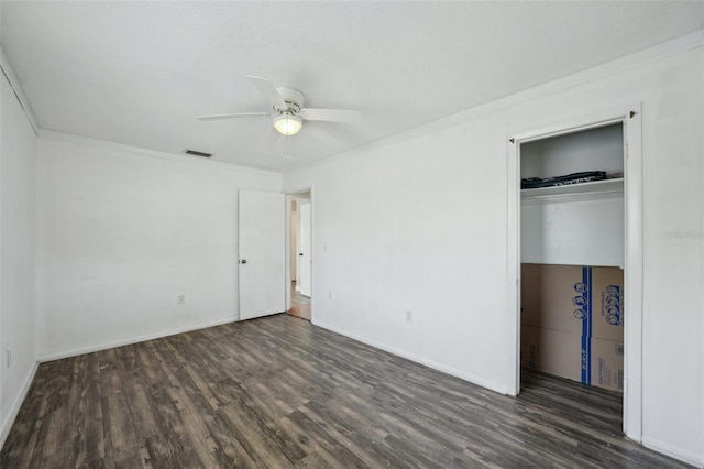 503 Holt Cir, Winter Haven, FL 33880 - unfurnished bedroom with wood finished floors, a closet, baseboards, ceiling fan, and ornamental molding