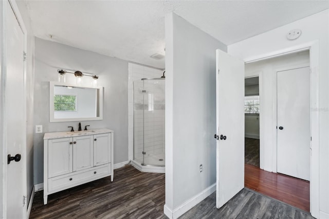 503 Holt Cir, Winter Haven, FL 33880 - bathroom with a stall shower, wood finished floors, and baseboards