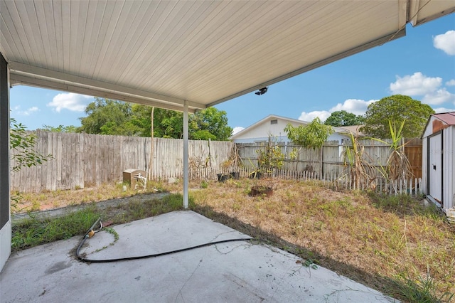503 Holt Cir, Winter Haven, FL 33880 - fenced backyard with a patio area