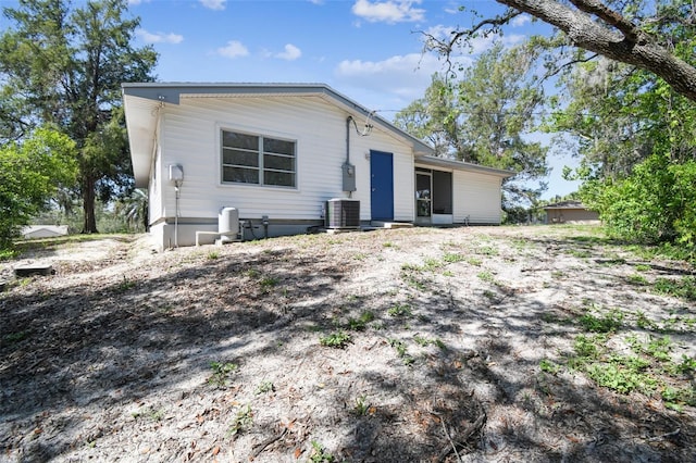 11409 Spring Hill Dr, Spring Hill, FL 34609 - view of front of property with central AC unit