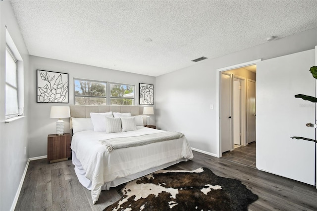 11409 Spring Hill Dr, Spring Hill, FL 34609 - bedroom with wood finished floors, a textured ceiling, and baseboards