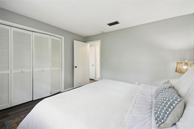 11409 Spring Hill Dr, Spring Hill, FL 34609 - bedroom featuring dark wood-style flooring and a closet