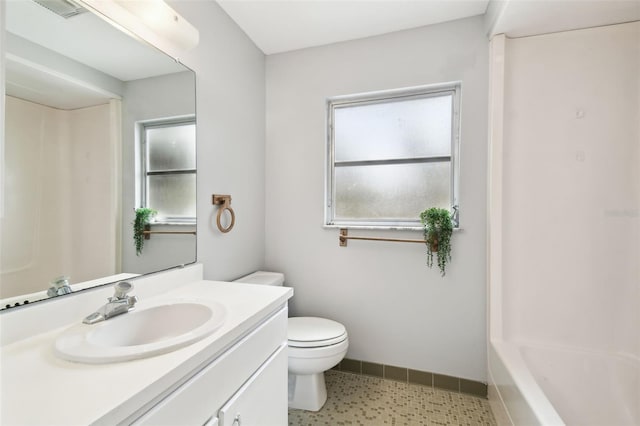 11409 Spring Hill Dr, Spring Hill, FL 34609 - bathroom with vanity, toilet, and baseboards