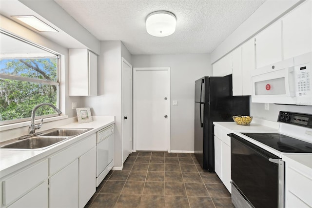 11409 Spring Hill Dr, Spring Hill, FL 34609 - kitchen featuring white appliances, a sink, a textured ceiling, white cabinetry, and light countertops