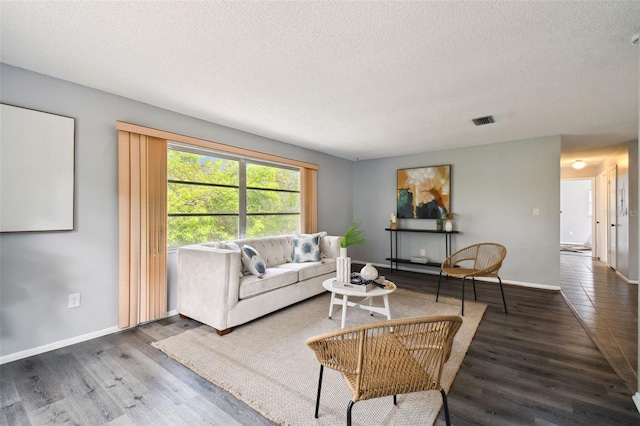 11409 Spring Hill Dr, Spring Hill, FL 34609 - living area with a textured ceiling, wood finished floors, and baseboards