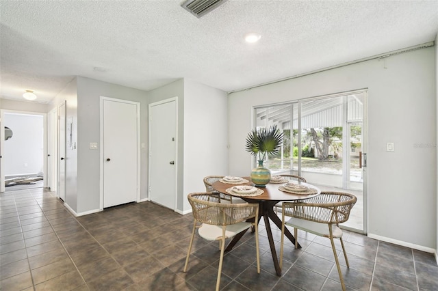 11409 Spring Hill Dr, Spring Hill, FL 34609 - dining space with a textured ceiling and baseboards