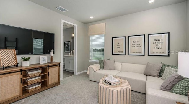 living room with carpet flooring, recessed lighting, and baseboards