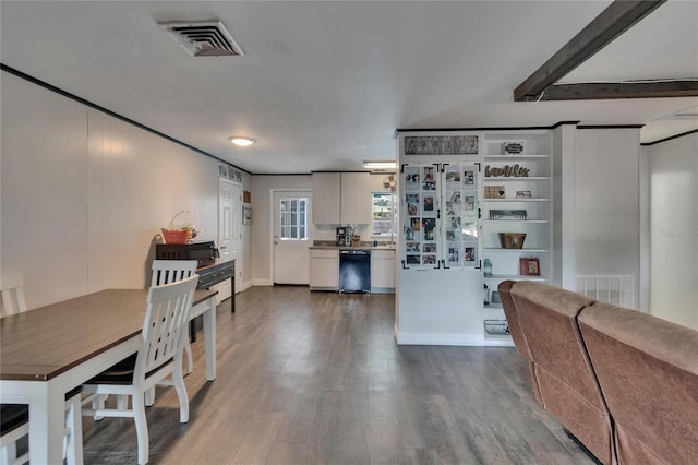 kitchen featuring black appliances, dark wood-type flooring, white cabinets, baseboards, and light countertops