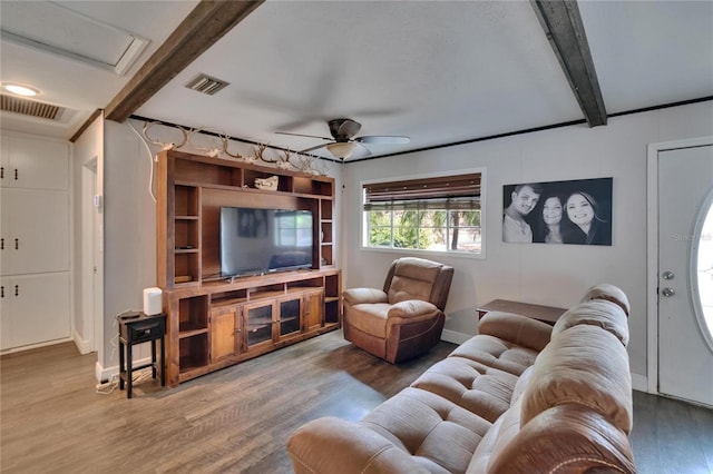 living area with beamed ceiling, wood finished floors, ceiling fan, and baseboards