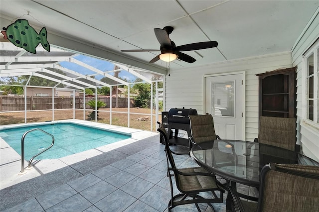view of pool featuring a patio area, a fenced backyard, outdoor dining area, ceiling fan, and glass enclosure