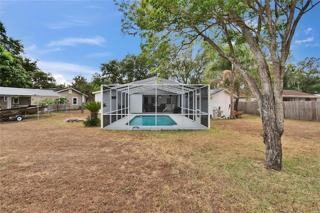 back of property with glass enclosure